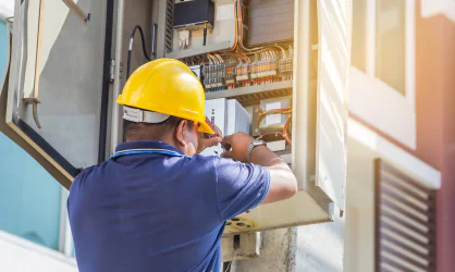 electrician repairing fuse circuit breaker box